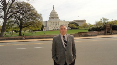 Stan Schultz, owner and founder of SSE, standing in front of the Capitol in Washington, D.C.